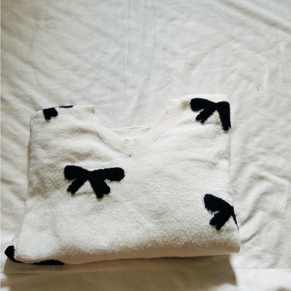 Elegant White and Black Bow Sweater